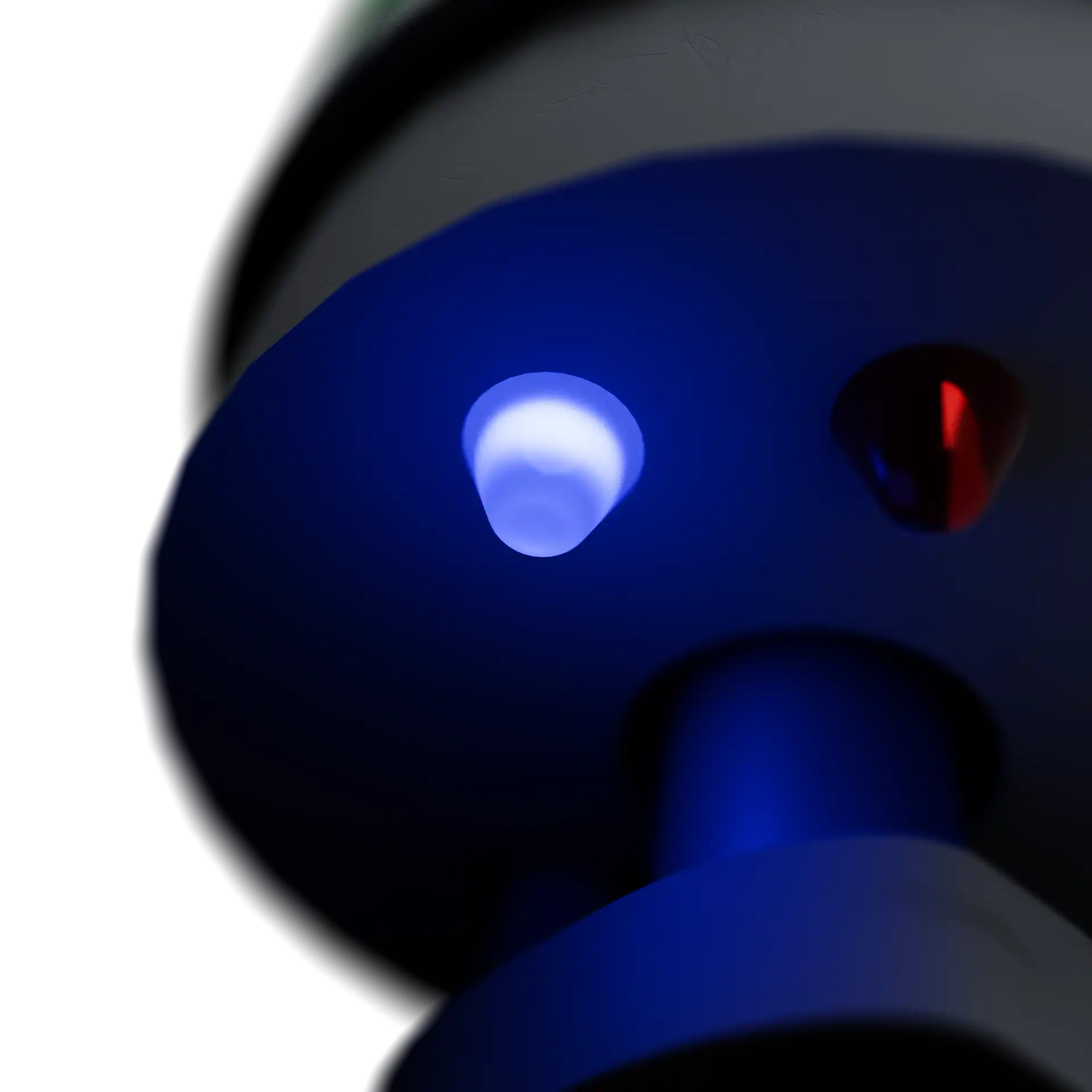 A close-up perspective rendering of the bottom of the RockTale Device, with a glowing blue light.